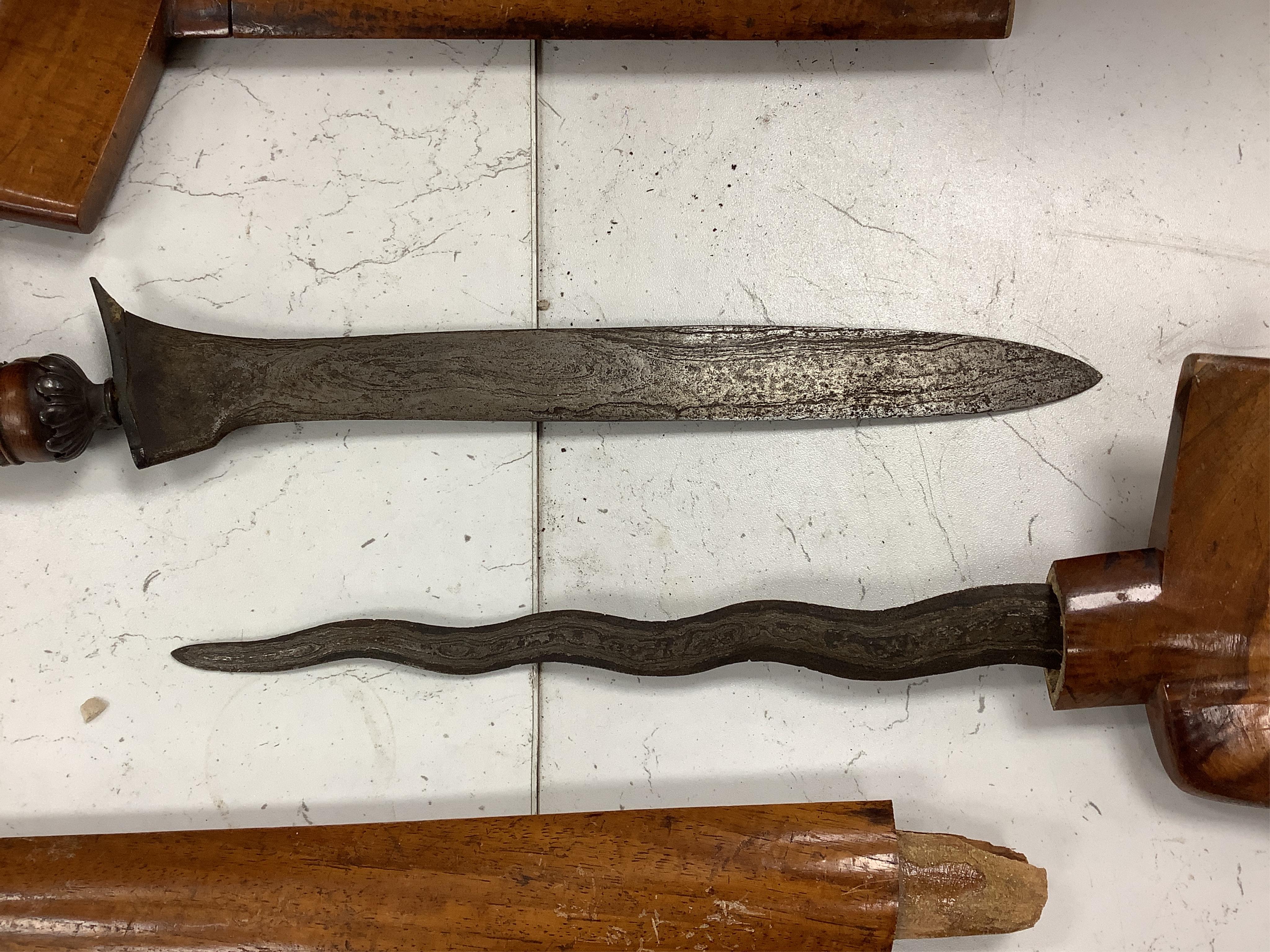 Two Kris daggers, a jambiya dagger and an Indonesian horn powder flask, longest 41.5cm. (4). Condition - poor to fair